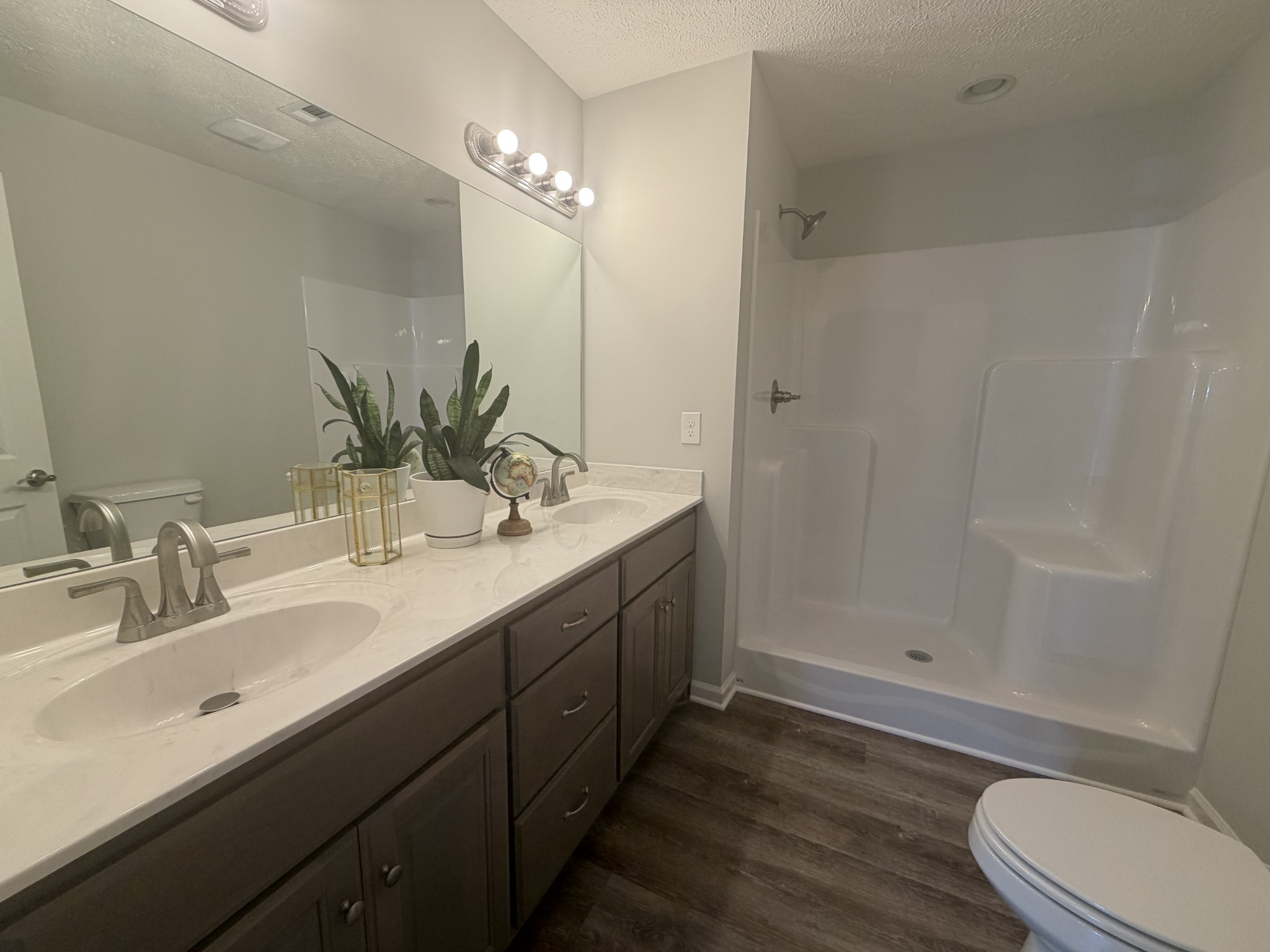 74 6 Mile Board Road Winchester, TN 37398 - Photo 81 of 99 a bathroom with a double vanity sink toilet and shower