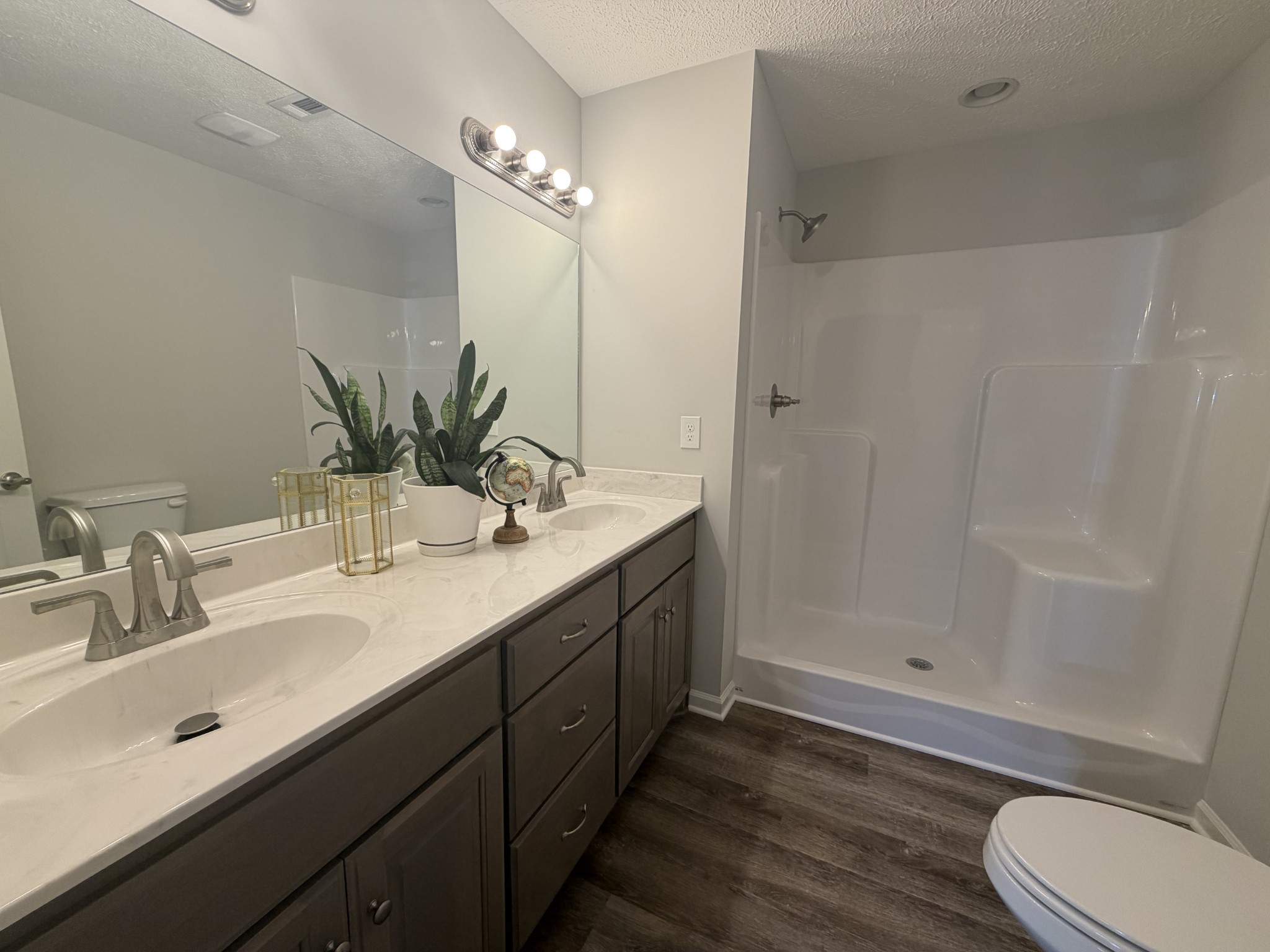 74 6 Mile Board Road Winchester, TN 37398 - Photo 83 of 99 a bathroom with a double vanity sink toilet and shower