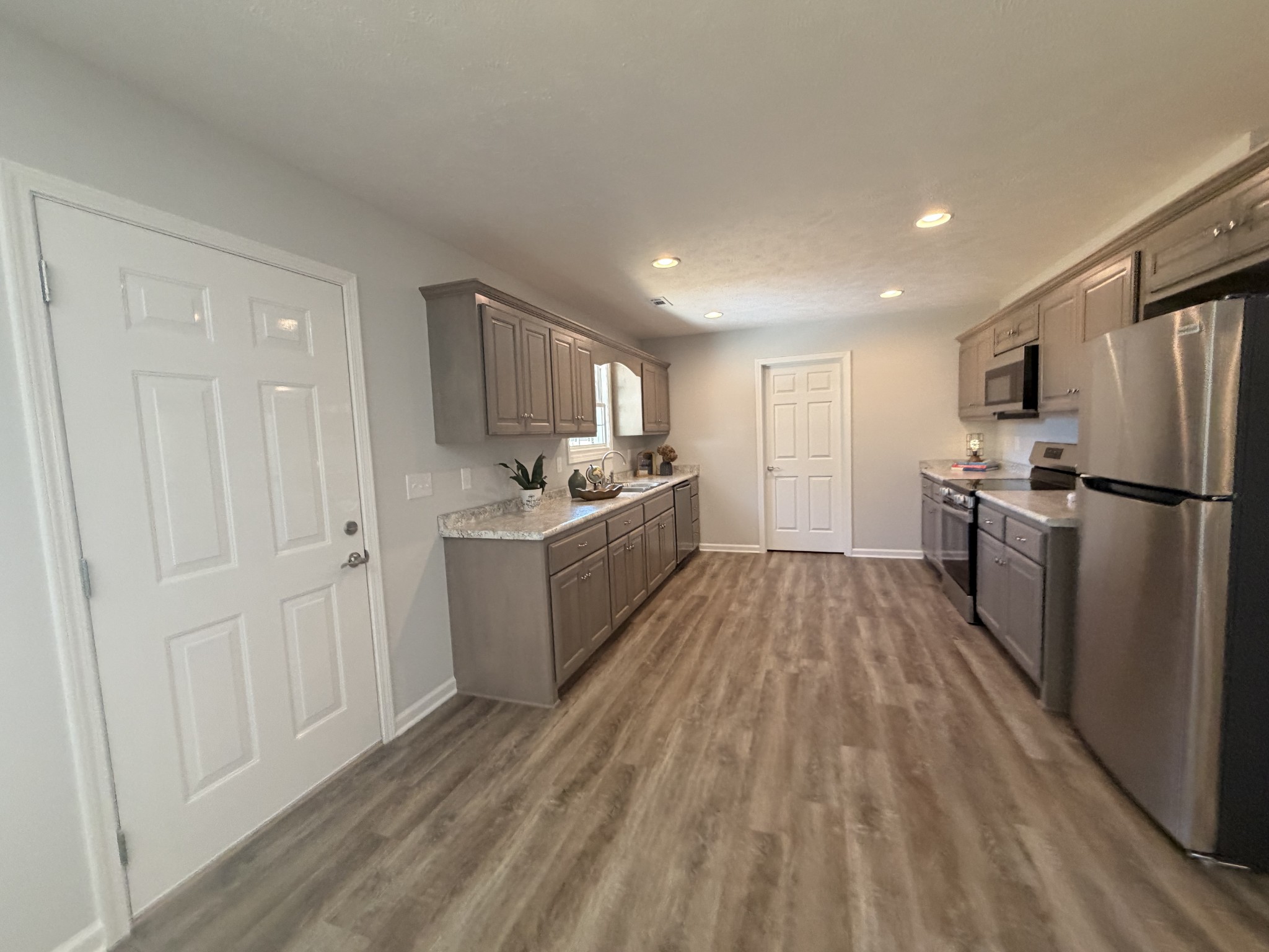 74 6 Mile Board Road Winchester, TN 37398 - Photo 84 of 99 a kitchen with a refrigerator and a sink