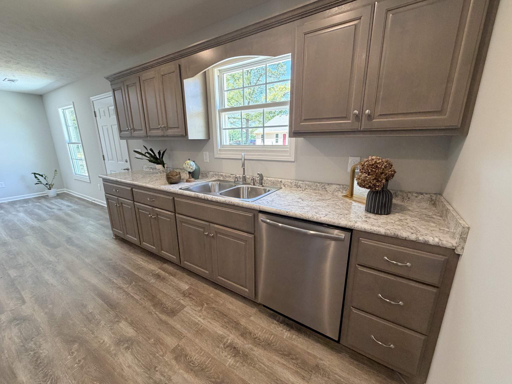 74 6 Mile Board Road Winchester, TN 37398 - Photo 88 of 99 a kitchen with stainless steel appliances granite countertop a sink window and cabinets