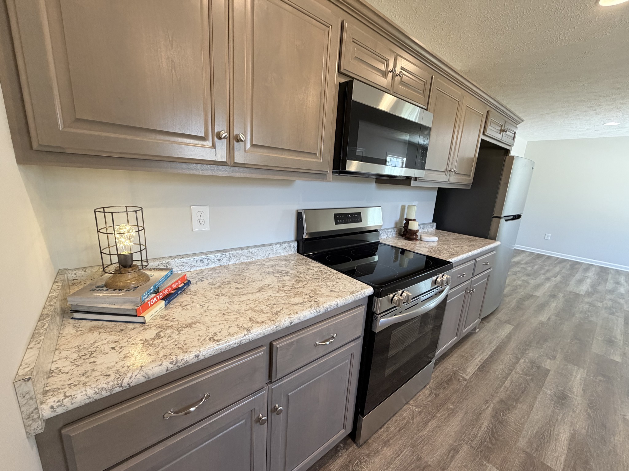 74 6 Mile Board Road Winchester, TN 37398 - Photo 90 of 99 a kitchen with granite countertop stainless steel appliances a stove microwave and sink