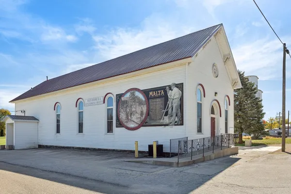 a front view of a building with parking