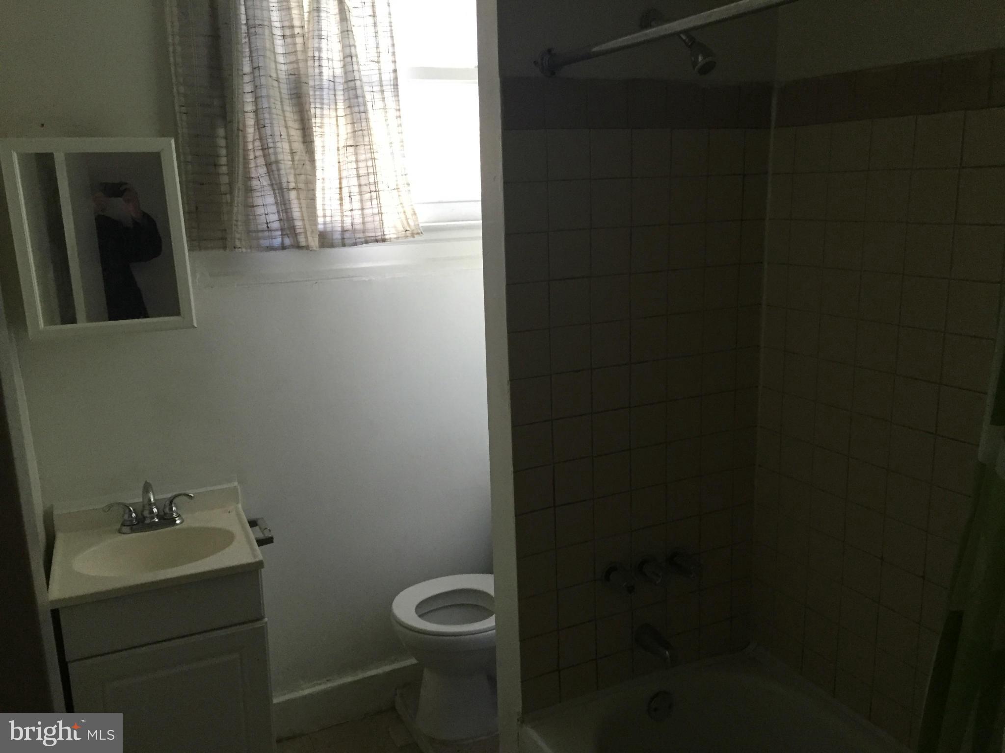 2734 Harford Road Baltimore, MD 21218 - Photo 12 of 12 a bathroom with a toilet and sink