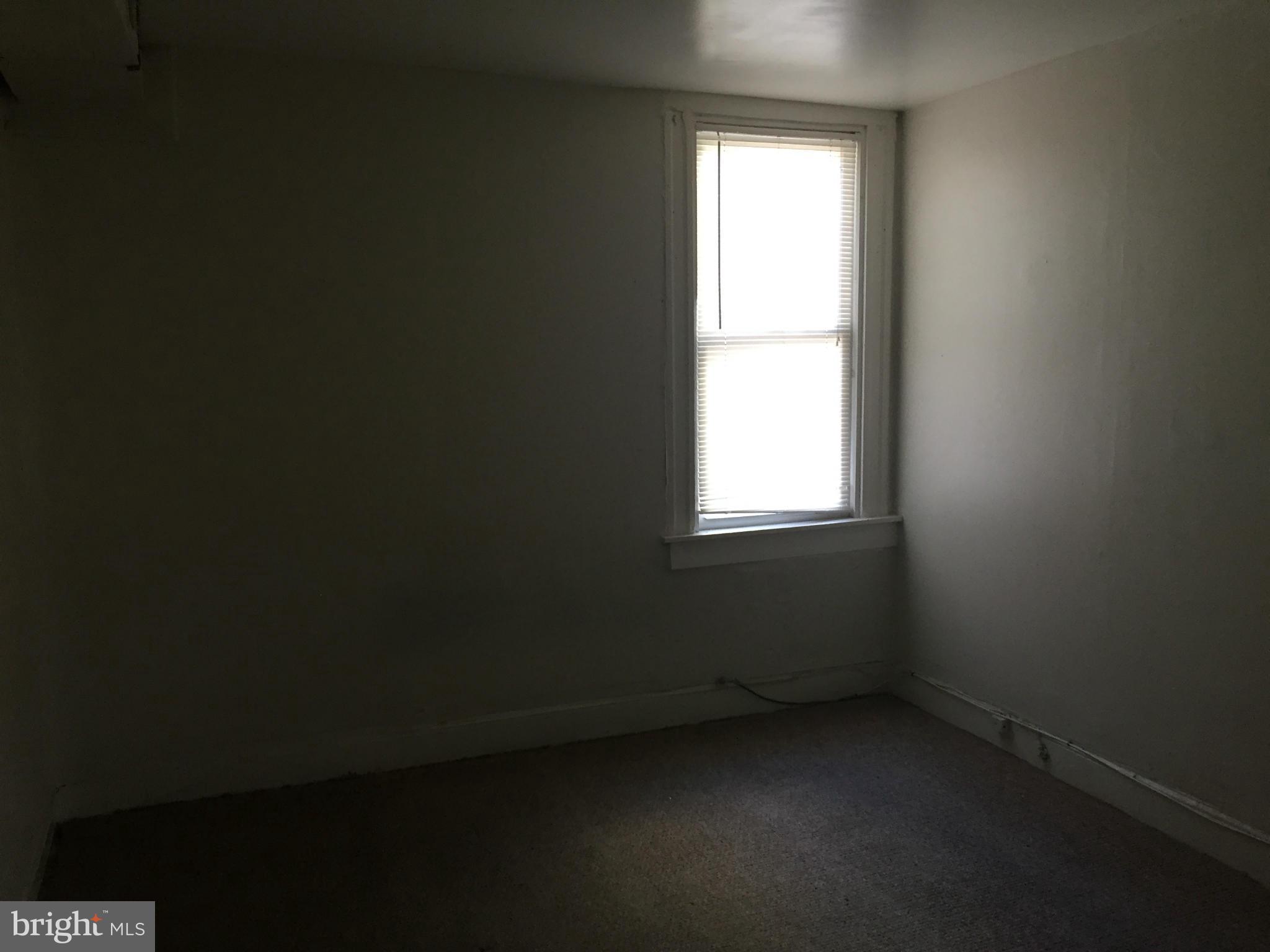 2734 Harford Road Baltimore, MD 21218 - Photo 10 of 12 a view of a room that has a window in it