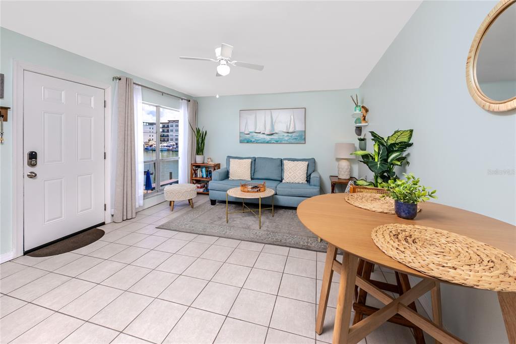159 Medallion Boulevard, Unit H Madeira Beach, FL 33708 - Photo 14 of 57 a living room with furniture and a table