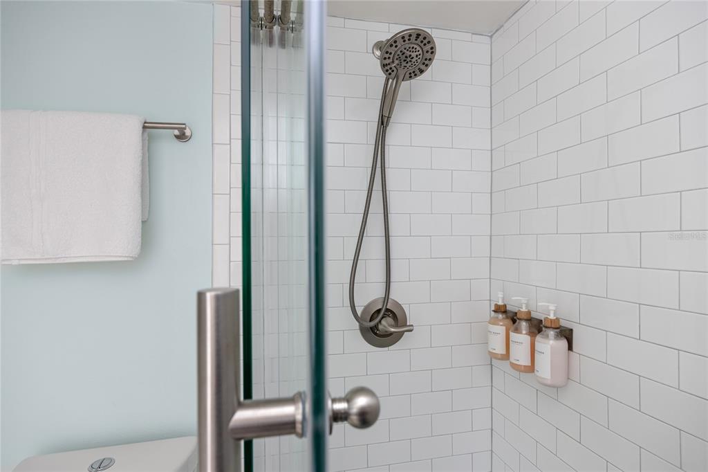 159 Medallion Boulevard, Unit H Madeira Beach, FL 33708 - Photo 29 of 57 a bathroom with a shower