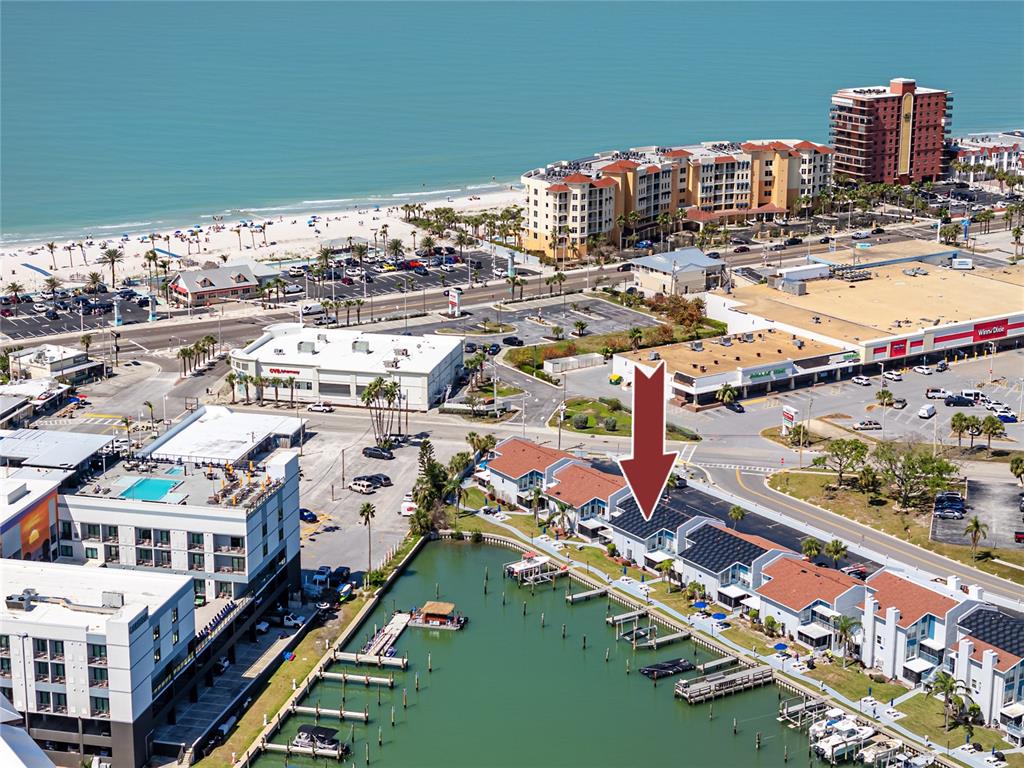 159 Medallion Boulevard, Unit H Madeira Beach, FL 33708 - Photo 4 of 57 a picture of city view with lake view