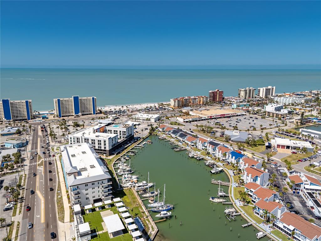 159 Medallion Boulevard, Unit H Madeira Beach, FL 33708 - Photo 53 of 57 a view of a city with a lake view