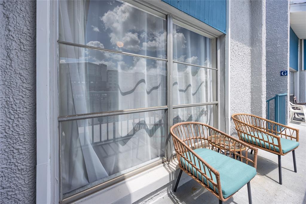 159 Medallion Boulevard, Unit H Madeira Beach, FL 33708 - Photo 6 of 57 a view of a balcony with furniture