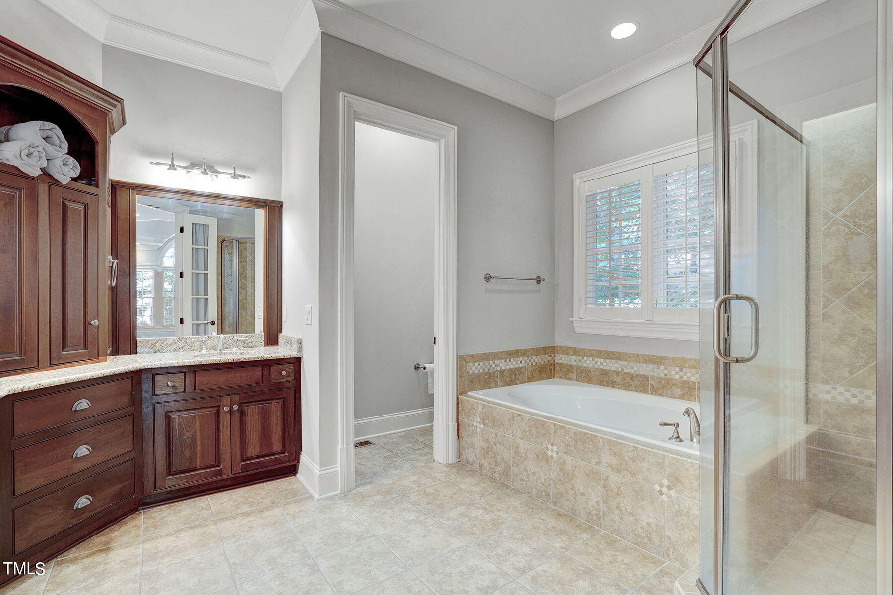 1016 Quiet Ridge Circle Raleigh, NC 27614 - Photo 15 of 31 a spacious bathroom with a granite countertop tub sink and mirror