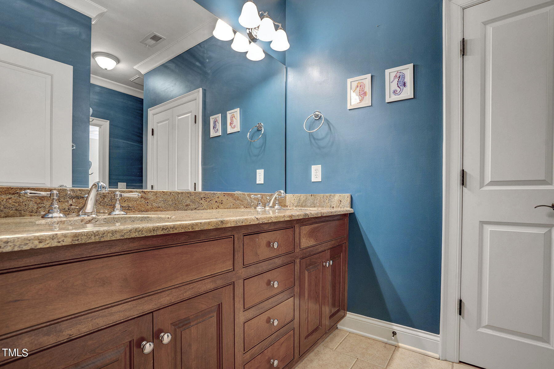 1016 Quiet Ridge Circle Raleigh, NC 27614 - Photo 19 of 31 a bathroom with a granite countertop double vanity sink a vanity and a mirror