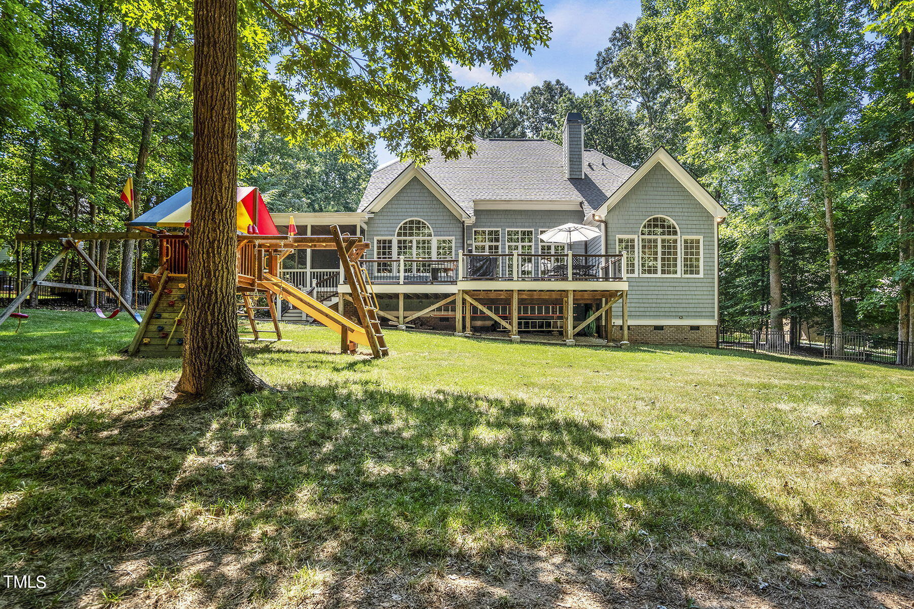 1016 Quiet Ridge Circle Raleigh, NC 27614 - Photo 30 of 31 a front view of a house with a yard and potted plants