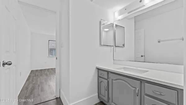 a view of storage and utility room with closet