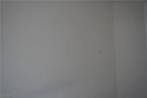 a bathroom with a sink toilet and a mirror