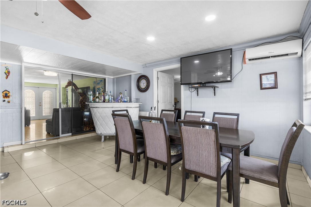 18 Illinois Road Lehigh Acres, FL 33936 - Photo 14 of 45 a view of a dining room with furniture