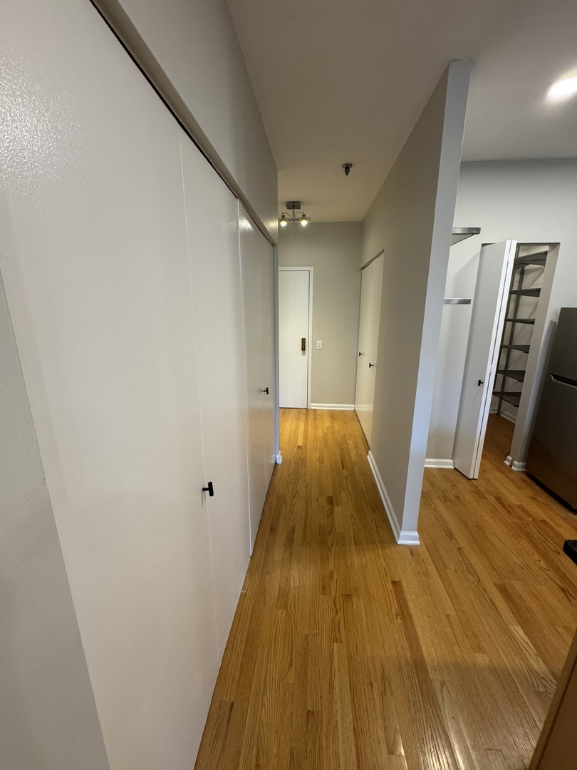 680 South Federal Street, Unit 903 Chicago, IL 60605 - Photo 11 of 27 a bathroom with a sink and a mirror