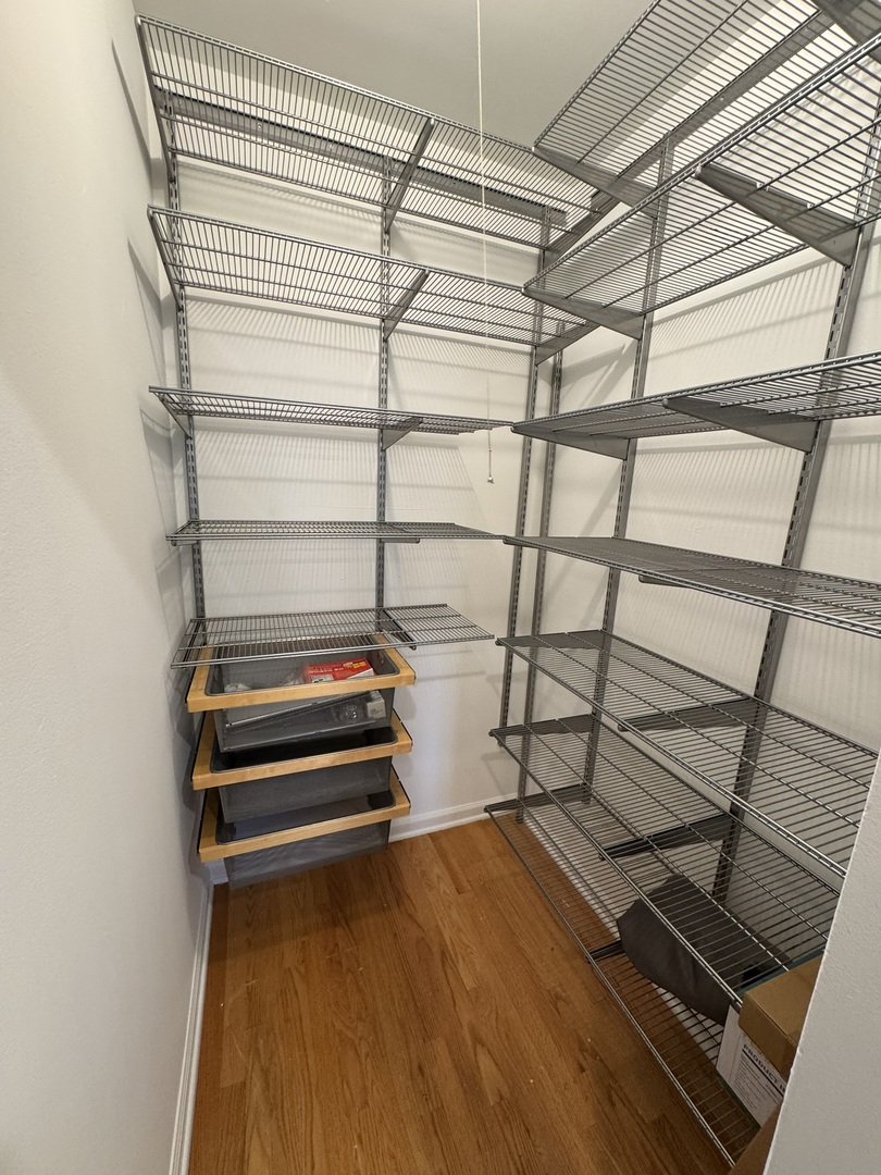 680 South Federal Street, Unit 903 Chicago, IL 60605 - Photo 4 of 27 a storage room with wooden floor