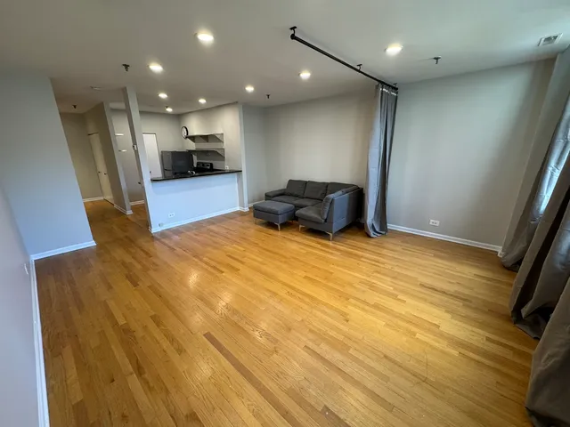 a bedroom with a bed and a view of balcony