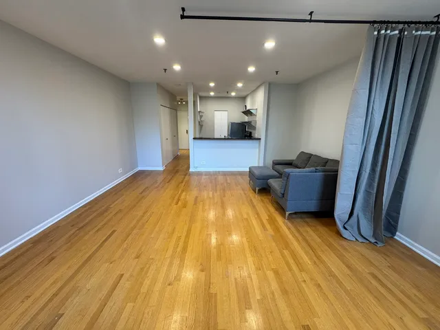 a view of kitchen and wooden floor