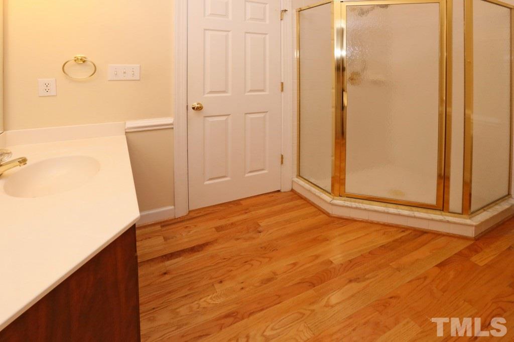 8204 Eden Close Court Raleigh, NC 27613 - Photo 12 of 25 view of empty room with wooden floor