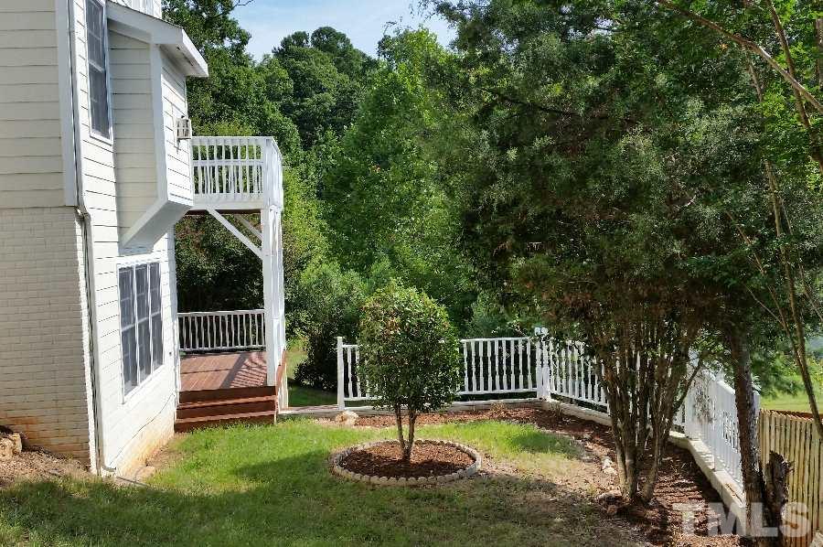 8204 Eden Close Court Raleigh, NC 27613 - Photo 24 of 25 a front view of a house with a yard