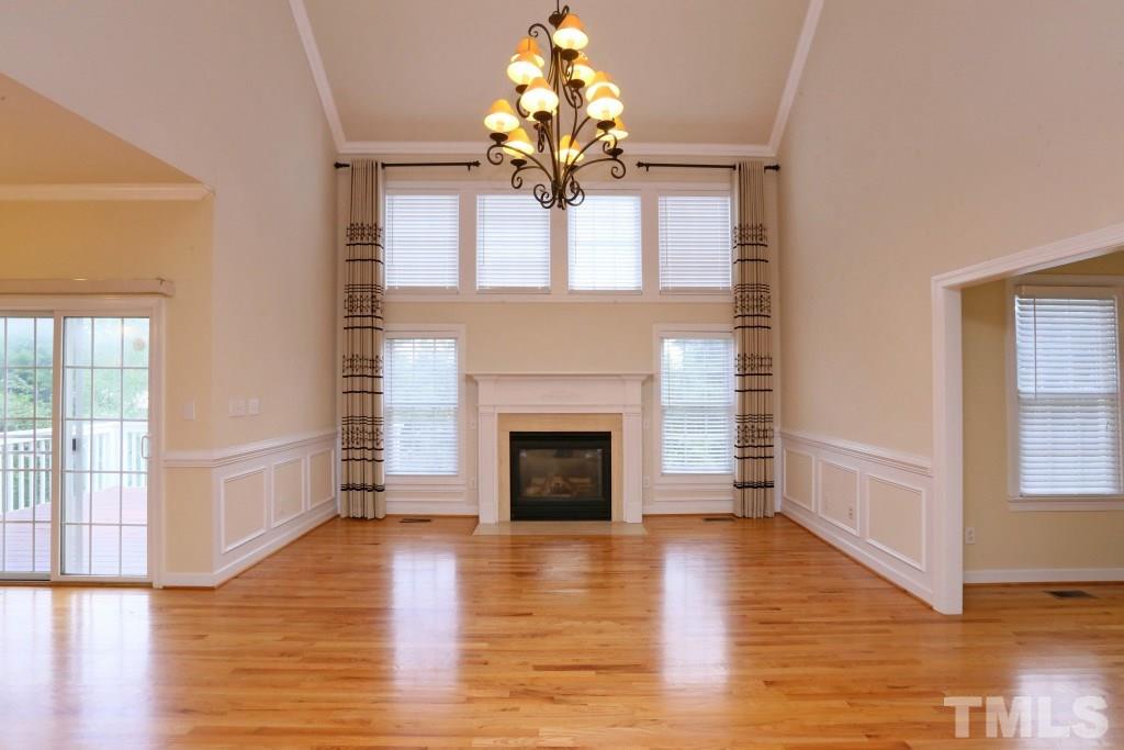 8204 Eden Close Court Raleigh, NC 27613 - Photo 4 of 25 a view of a livingroom with a fireplace window and wooden floor