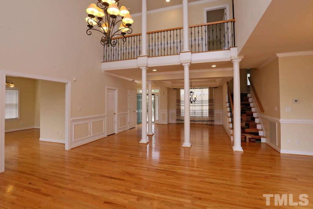 8204 Eden Close Court Raleigh, NC 27613 - Photo 5 of 25 a view of an entryway with wooden floors