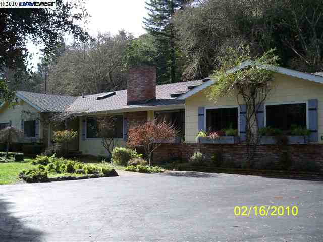 31001 Palomares Road Castro Valley, CA 94552 - Photo 1 of 1 a front view of a house with a garden