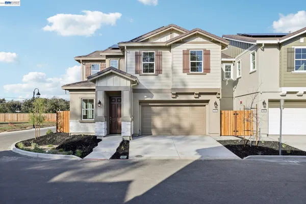 a front view of a house with yard