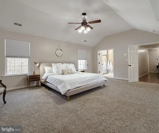 a spacious bathroom with a double vanity sink mirror and toilet