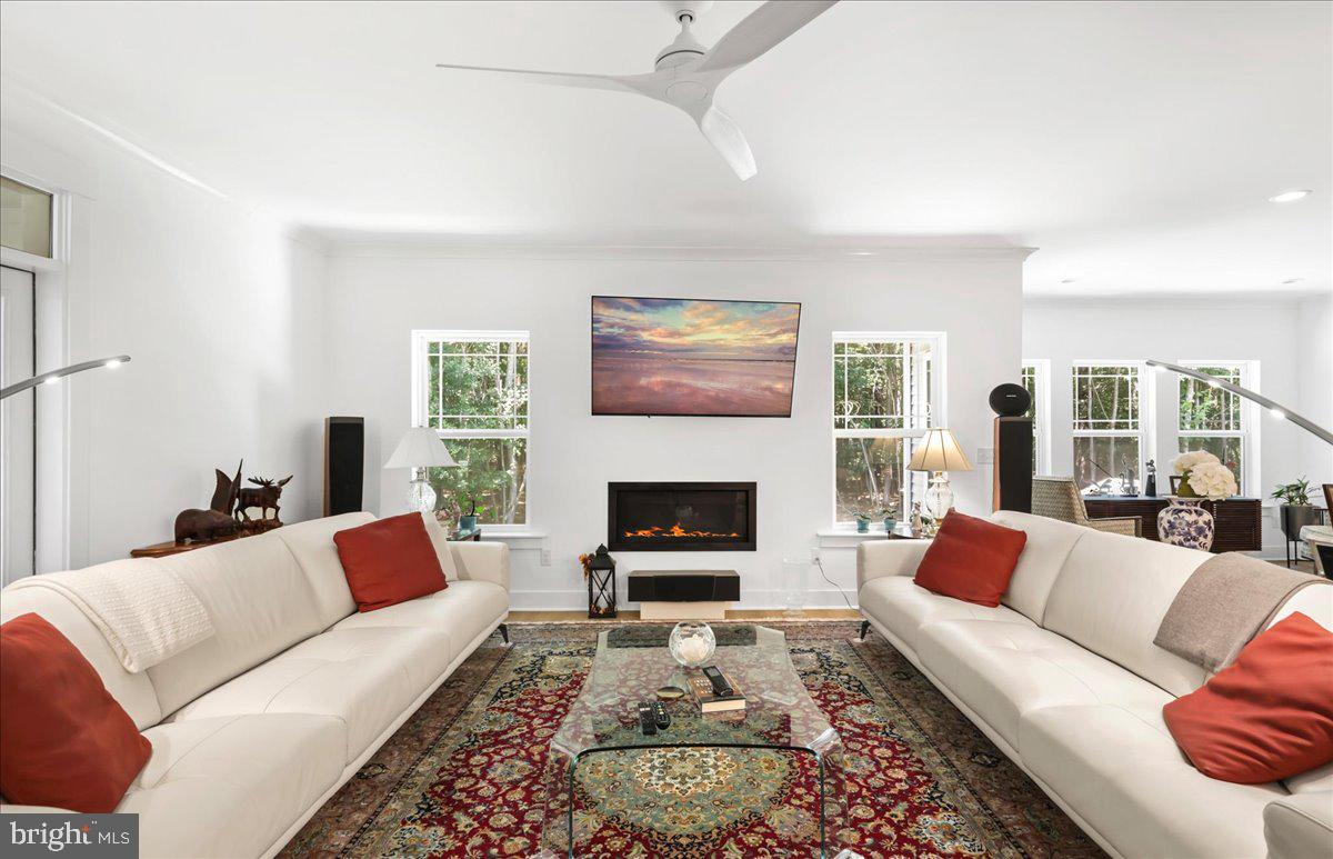 36755 Double Bridges Road Frankford, DE 19945 - Photo 14 of 38 a living room with furniture and a fireplace