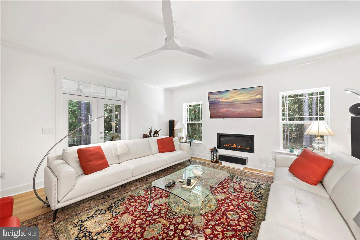 36755 Double Bridges Road Frankford, DE 19945 - Photo 15 of 38 a living room with furniture a rug and a fireplace