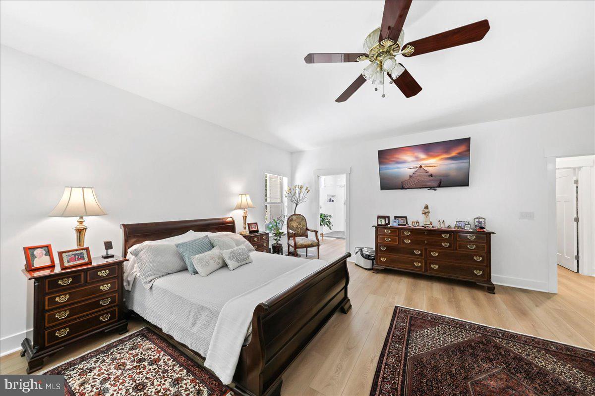 36755 Double Bridges Road Frankford, DE 19945 - Photo 16 of 38 a bedroom with bed and a flat tv screen on a dresser