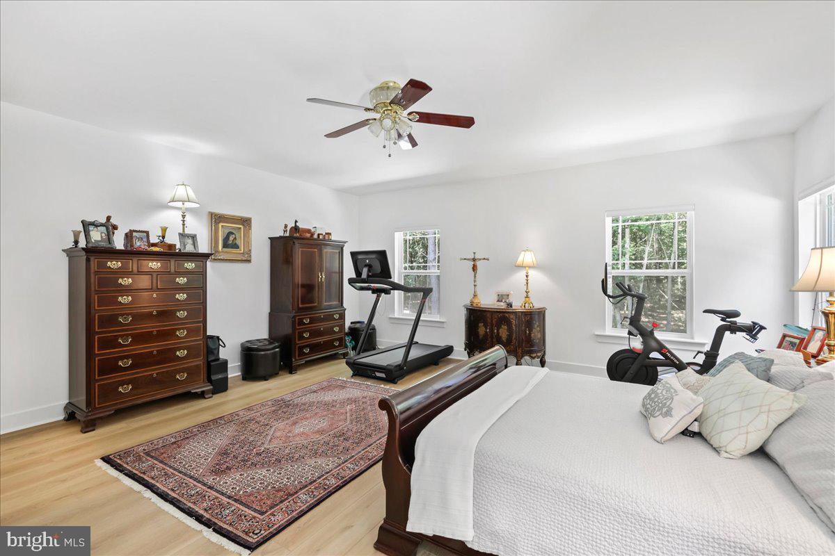 36755 Double Bridges Road Frankford, DE 19945 - Photo 19 of 38 a bedroom with a bed and dresser