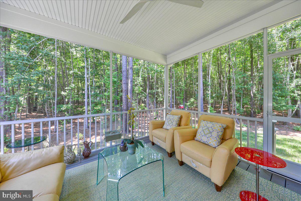 36755 Double Bridges Road Frankford, DE 19945 - Photo 26 of 38 a living room with furniture and a floor to ceiling window