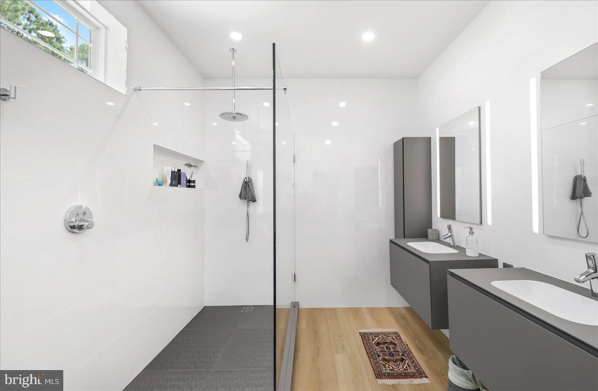 36755 Double Bridges Road Frankford, DE 19945 - Photo 29 of 38 a bathroom with a shower sink and mirror