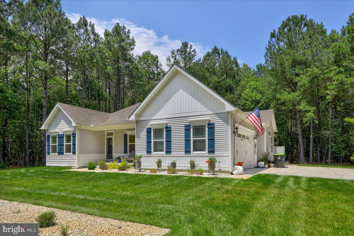 36755 Double Bridges Road Frankford, DE 19945 - Photo 32 of 38 a front view of house with yard and green space