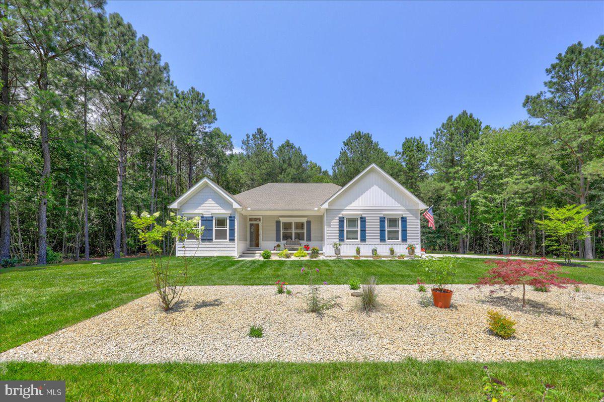 36755 Double Bridges Road Frankford, DE 19945 - Photo 33 of 38 a front view of a house with a yard and trees