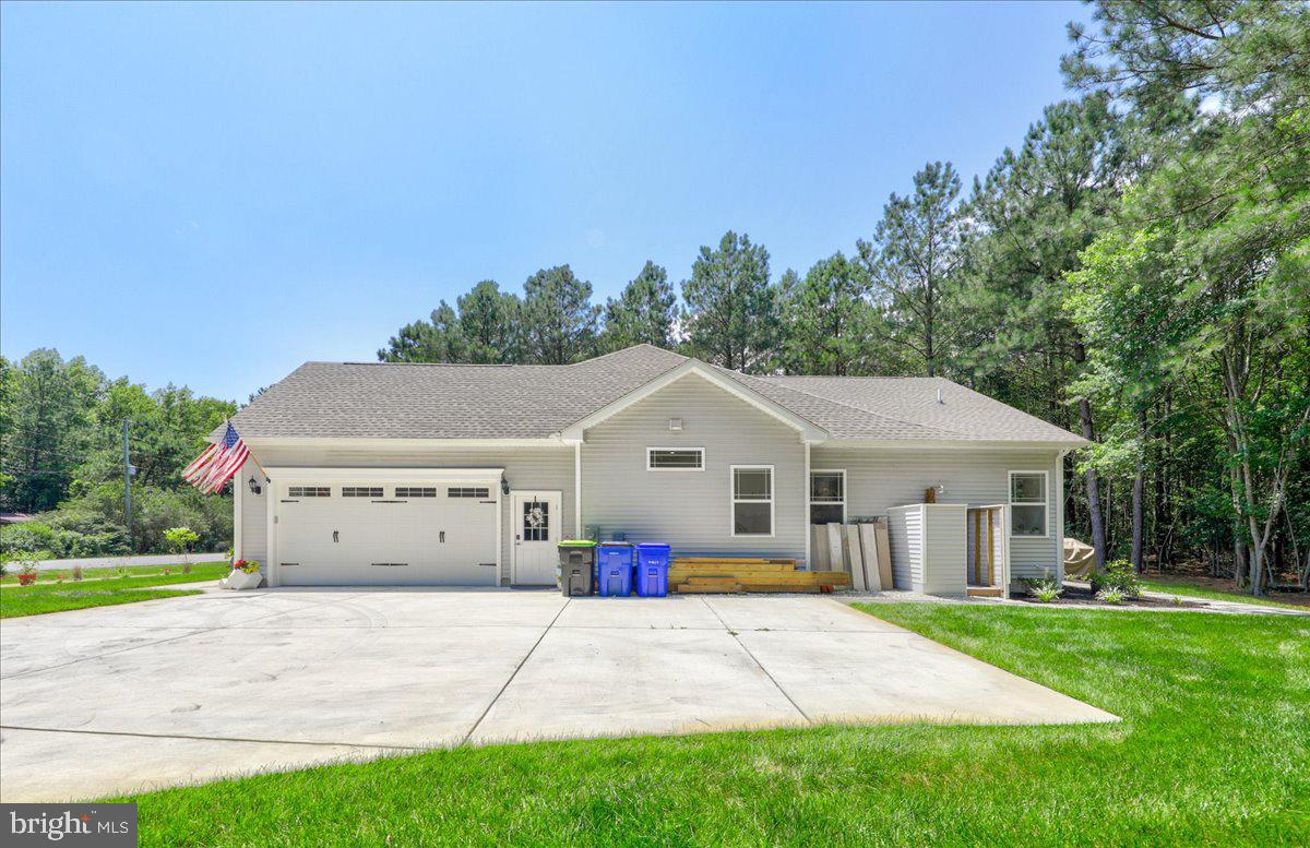 36755 Double Bridges Road Frankford, DE 19945 - Photo 35 of 38 a front view of house with yard and green space