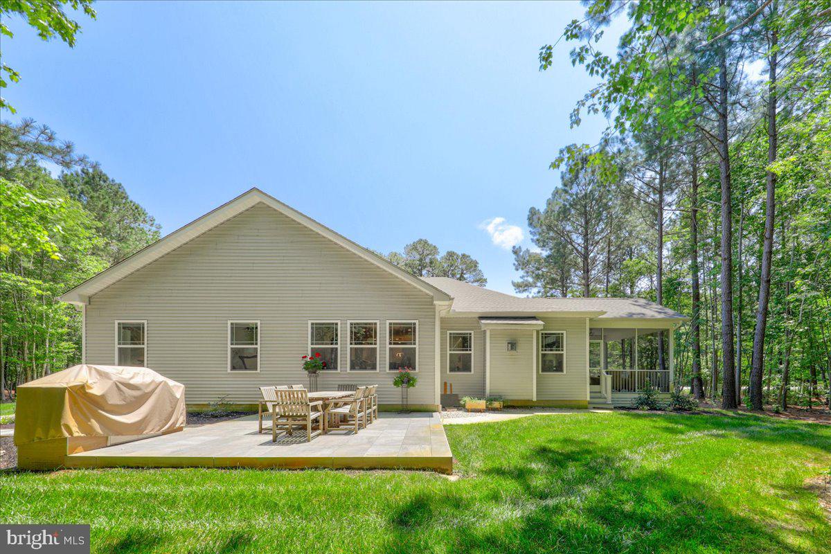 36755 Double Bridges Road Frankford, DE 19945 - Photo 37 of 38 a front view of house with a garden and patio