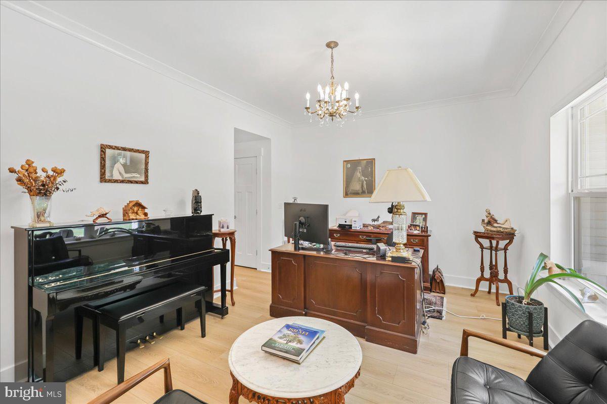 36755 Double Bridges Road Frankford, DE 19945 - Photo 4 of 38 a living room with furniture a piano and a flat screen tv