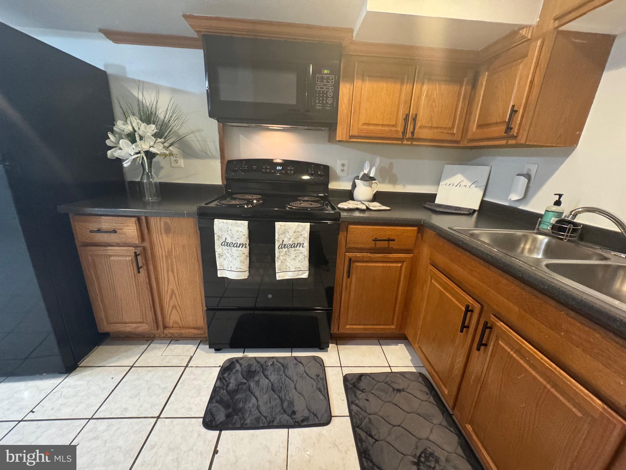 45 Rhode Island Avenue Northwest Washington, DC 20001 - Photo 4 of 17 a kitchen with stainless steel appliances granite countertop a sink stove and cabinets