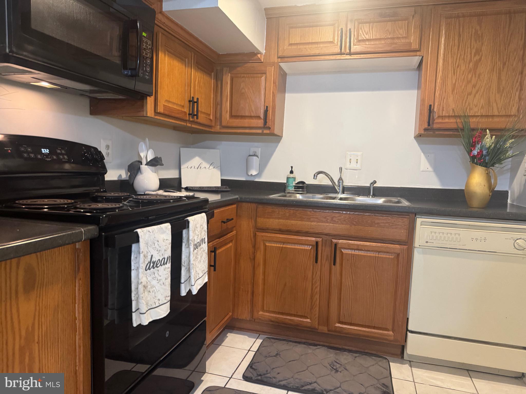 45 Rhode Island Avenue Northwest Washington, DC 20001 - Photo 5 of 17 a kitchen with stainless steel appliances granite countertop a sink stove and cabinets