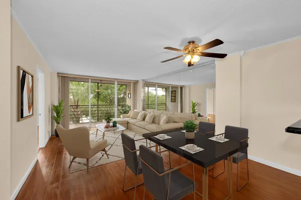 a view of a dining room with furniture window and outside view