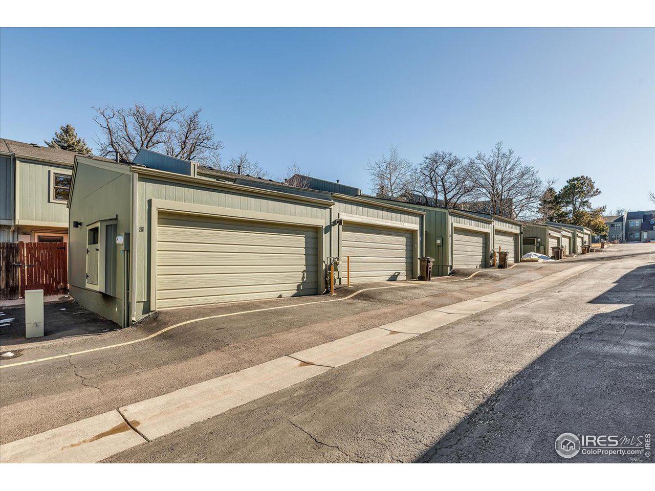 81 Benthaven Place Boulder, CO 80305 - Photo 31 of 32 a front view of a house with a yard and garage