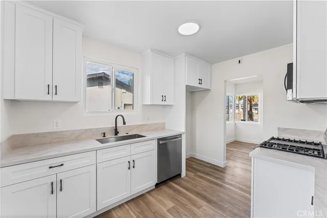 a kitchen with a sink and cabinets