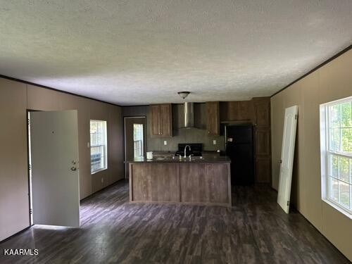 306 Dynatex Road Lancing, TN 37770 - Photo 2 of 13 a living room with furniture and a wooden floor