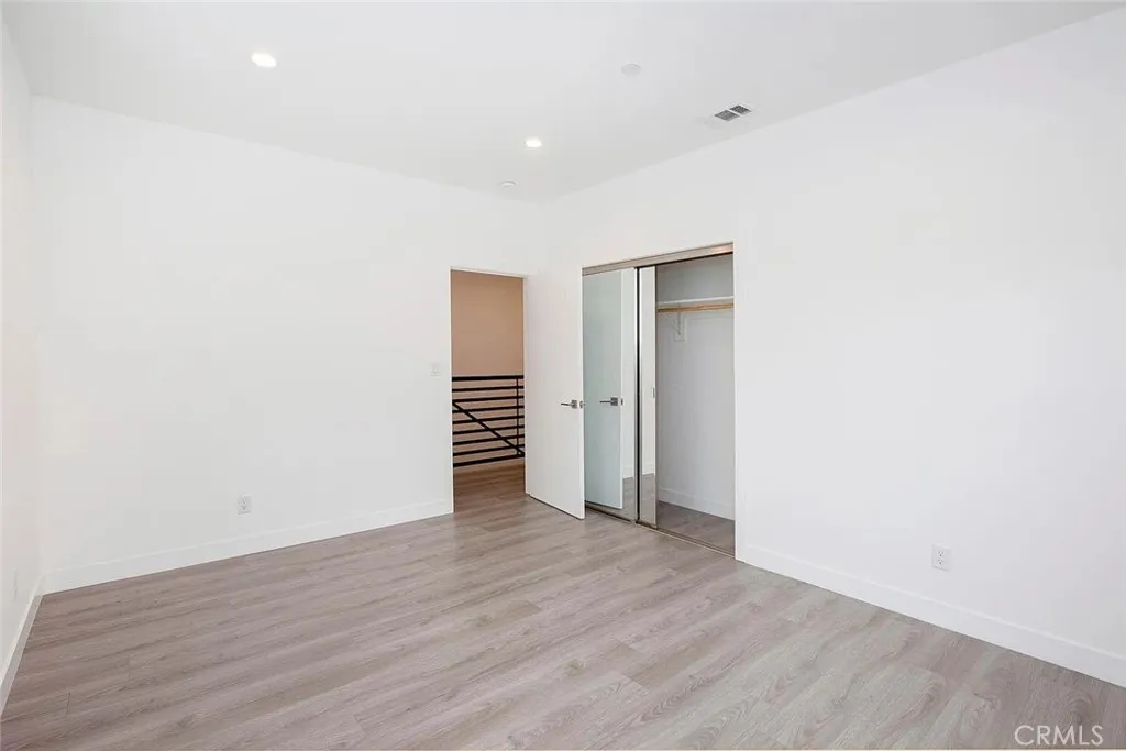 5024 Cleon Avenue North Hollywood, CA 91601 - Photo 14 of 22 a view of an empty room with wooden floor