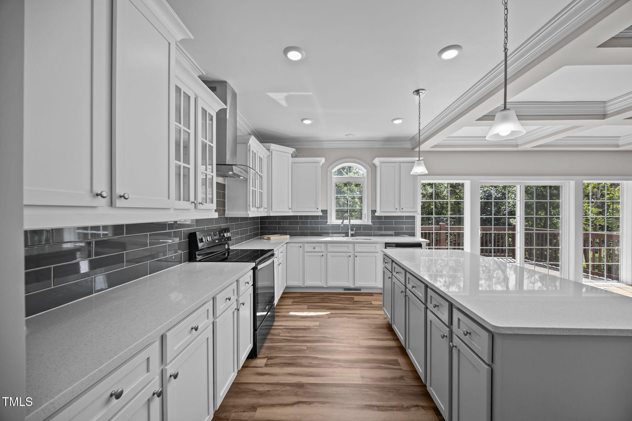 6117 David Moore Road Burlington, NC 27217 - Photo 21 of 51 a kitchen with stainless steel appliances granite countertop a sink and dishwasher a stove top oven with wooden floor