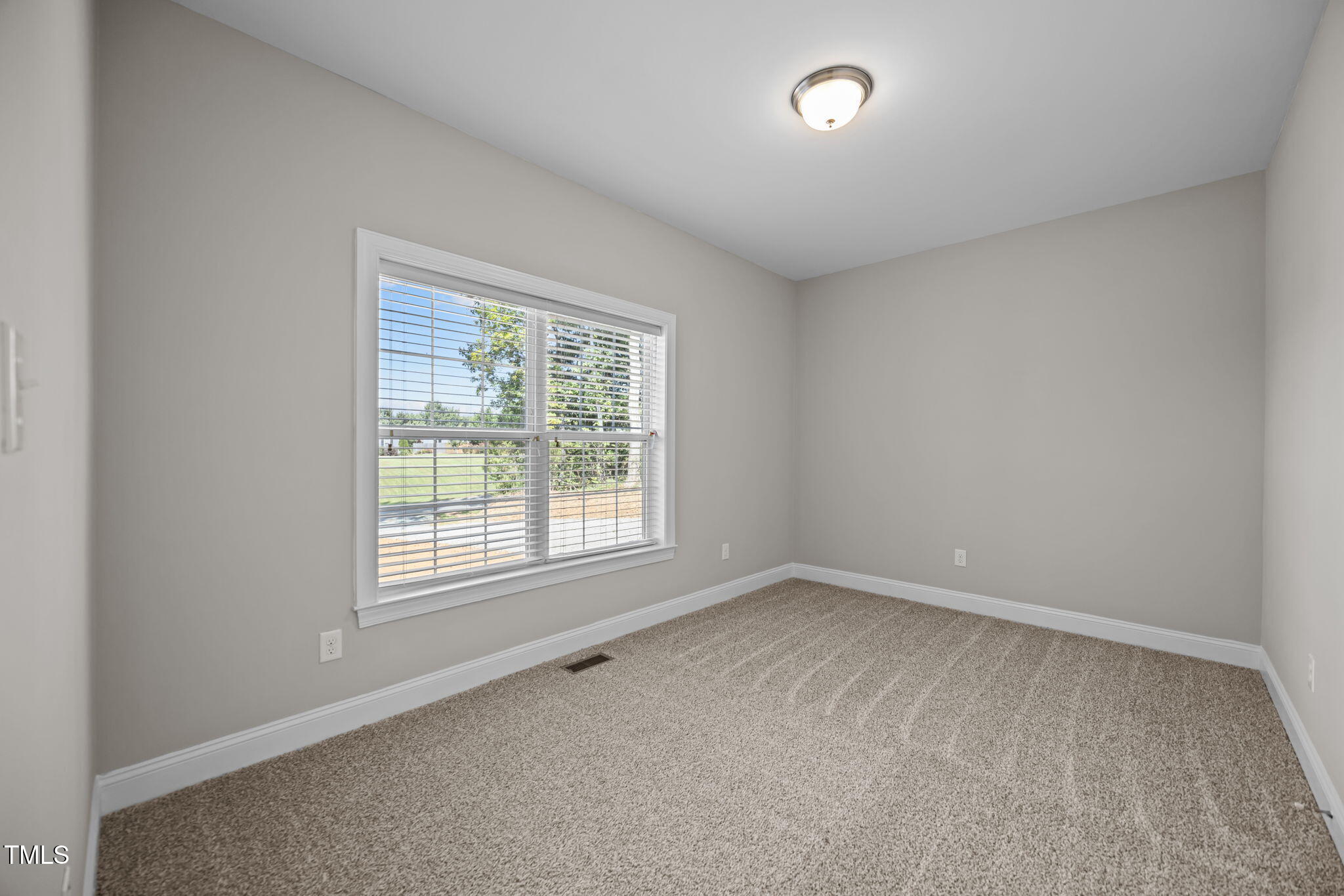 6117 David Moore Road Burlington, NC 27217 - Photo 31 of 51 an empty room with a window